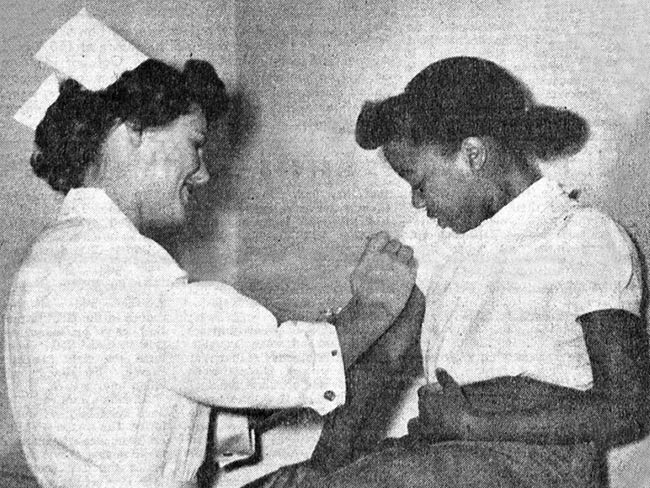 "Permanente pediatric clinic at 515 Market St, San Francisco - nurse giving Patricia Nisby, daughter of ILWU Local 10 member Wiley Nisby, a shot." ILWU Dispatcher, 10/13/1950.