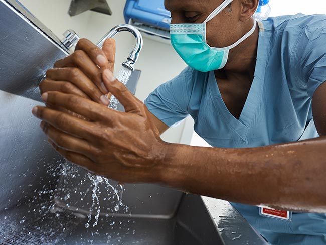 medical worker washing hands