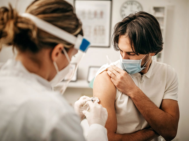 Man receiving a COVID-19 vaccine