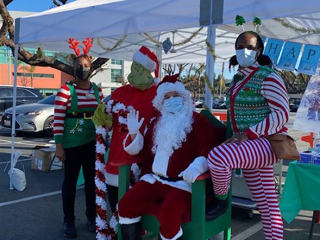 Santa, his elves, and the Grinch brought holiday joy at a flu vaccine event. 